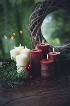 Burning red and white wax candles as a symbol of faith. Vertical background for religious traditions and holidays. Space for text.