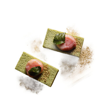 Kyoto Traditional Kyo-kaiseki Dessert A graceful overhead composition of a seasonal kyo-kaiseki dessert-a matcha sponge cake topped with sakura leaf