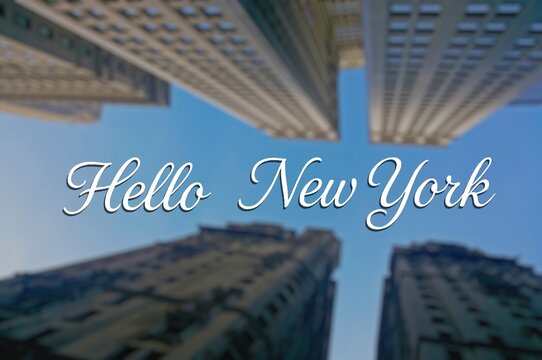 The inscription "Hello, New York" against the background of the blurred skyscrapers of the financial district of New York, view from below.  typography, postcards for tourism and greetings.