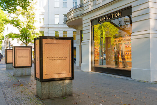 Berlin, Germany - August 27, 2026: Louis Vuitton flagship boutique and outdoor monogram display pillars on Kurfuerstendamm in Berlin, Germany. High-end retail avenue in an affluent urban district.