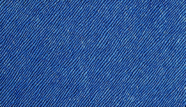 A swatch of vibrant, textured blue denim displays a prominent diagonal weave. It&rsquo;s a close-up of fabric.