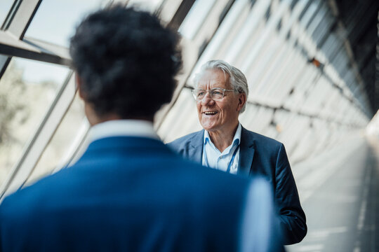 Businessman talks to colleague at modern trade fair