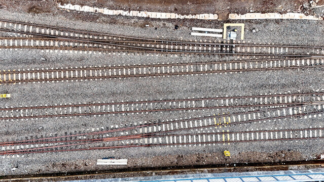 Aerial view of Cicalengka railway tracks with gravel ballast and switches in Bandung, West Java, Indonesia.