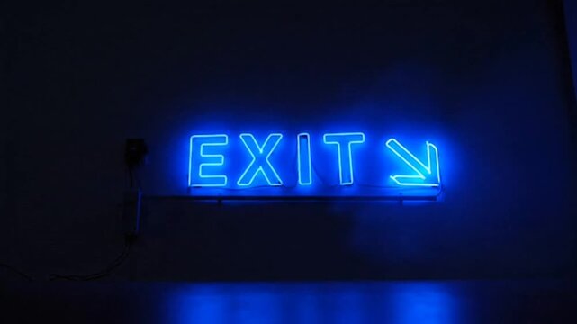 Blue Neon EXIT Sign with Right Arrow in Dark Interior