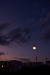 Full Moon with urban silhouettes. © astrosystem