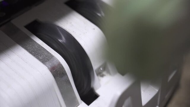 selective focus close up to Money counting machine in motion while bank note were counting action. Banking operation with money Business concept with money. Counting machine for money theme.