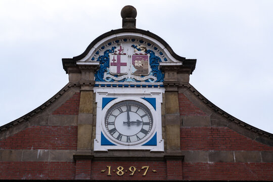 Entrance pediment and clock at Windsor Royal Station shopping arcade