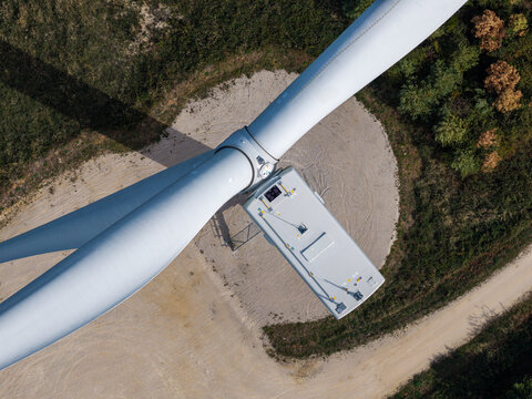 Aerial view of Parc eolien des trois cantons wind turbine nacelle and blades from above in Etouvans, Bourgogne-Franche-Comte, France.