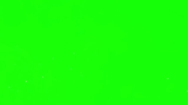 Glowing fiery sparks floating upwards against bright chroma key green background
