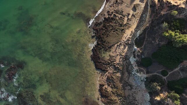 Aerial rocks and cliffs seascape shore view of beach, Algarve. Praia do Barranco das Belharucas