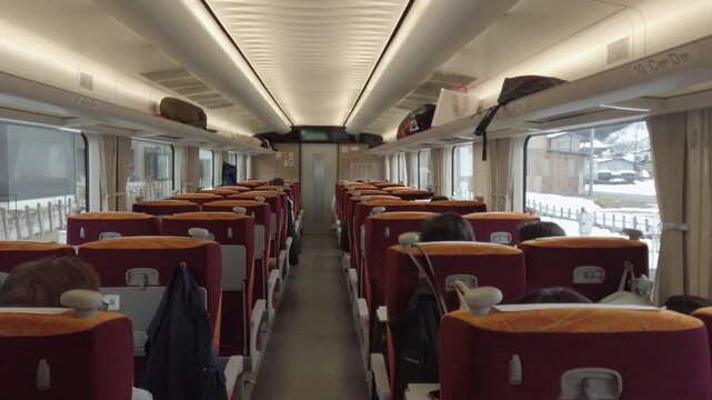 interior view inside express train full with passenger sitting in train commuters while train moving running in high speed,japan public train transportation from inside