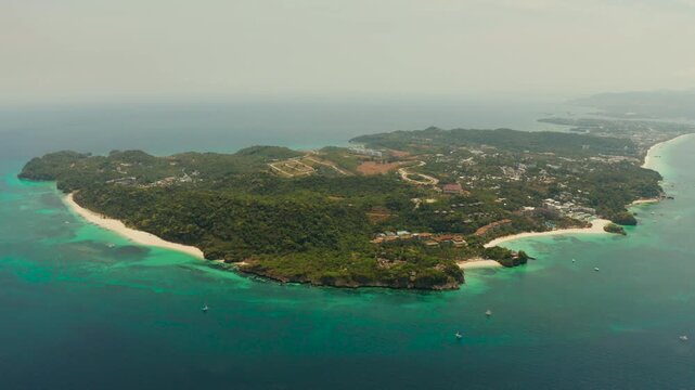 Costline of the tropical island of Boracay with sandy beaches and hotels from above. Summer and travel vacation concept. Philippines.