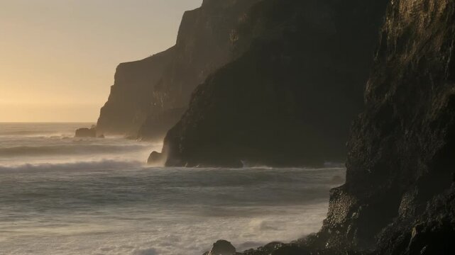 Ocean waves crashing against the miraflores lima cliff at sunset