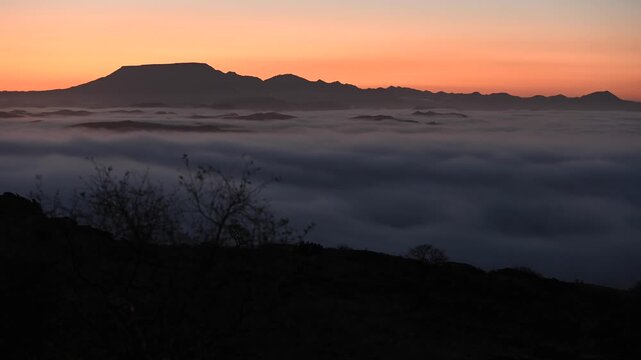In the early morning, clouds drift over beautiful hills,  African landscape. Timelapse