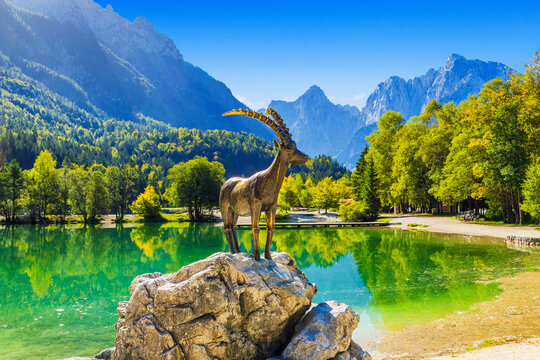 Statue of Kozorog goat on beautiful Lake Jasna in Kranjska Gora, Alps, Slovenia
