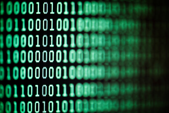 Binary code background on computer screen