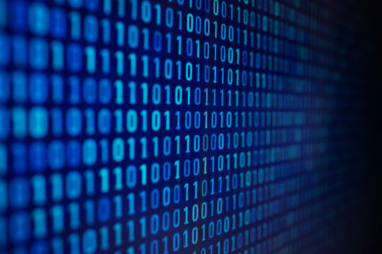 Binary code background on computer screen