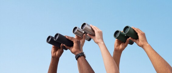 Fototapeta premium Group of Diverse People Raising Binoculars Toward the Clear Blue Sky, Representing Vision, Shared Goals, Future Discovery, and Strategic Perspective Shift for Business and Personal Growth.