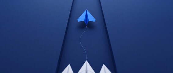 Fototapeta premium Innovative blue paper plane flying ahead of a group of white planes on a blue background, representing leadership, vision, career growth, and unique business strategy with perspective shift.