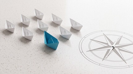 Fototapeta premium A single blue paper boat leading a fleet of white origami boats towards a compass rose symbol on a textured surface, representing leadership, vision, strategic direction, and business success.