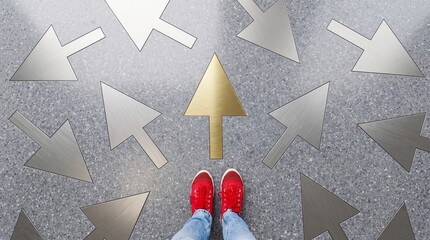 Fototapeta premium Person in Red Sneakers Standing on Stone Floor with Multiple Metal Arrows, One Gold Arrow Pointing Forward Symbolizing Success, Unique Career Path, Leadership, and Premium Choice Decision