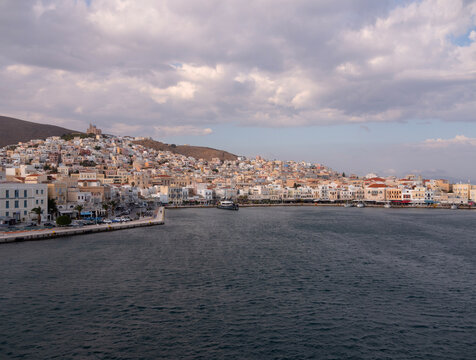 Syros, Greece. October 1, 2026. Sunset view from the sea to the capital of the island of Syros, Ermoupolis, Greece