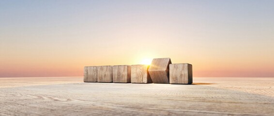 Fototapeta premium Conceptual wide angle view of blank wooden cubes on a wooden deck at sunrise representing a new beginning, future planning, business strategy, career growth and the start of a successful journey.