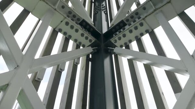 Low-angle view of architectural steel beams and wooden slats
