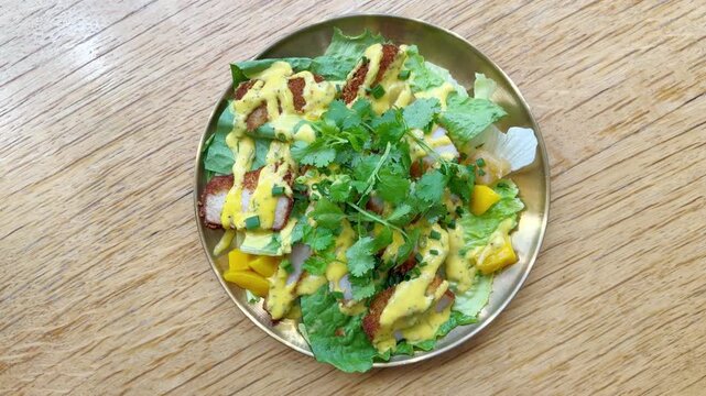 Plate of Asian Chicken Salad Topped with Fresh Cilantro on Table &ndash; Healthy Vietnamese or Thai Style Salad