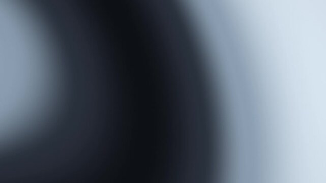 A dark charcoal and silver gradient flows gently across the frame, creating an elegant atmospheric motion background for presentations, websites, and digital designs.