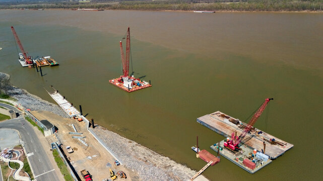 Paducah riverfront construction with multiple crane barges