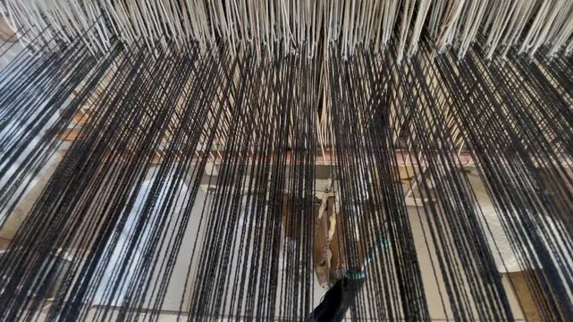 Intricate Details of Warp Threads on a Traditional Weaving Handloom in a Local Chitral Workshop