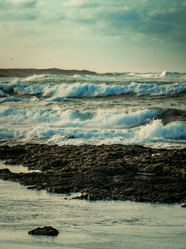 Waves breaking along a rocky shoreline