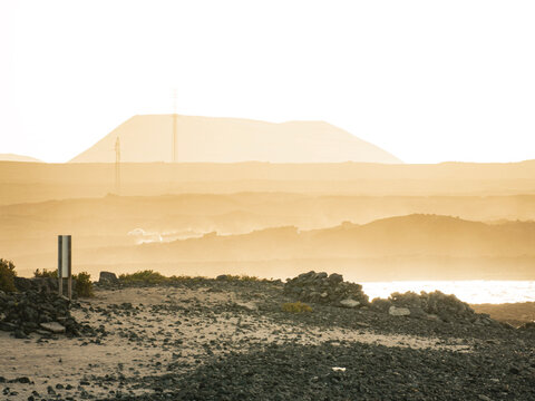 Distant mountains and coastline in soft evening light