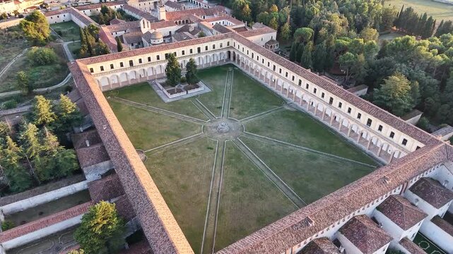 Aerial view of the vast Great Cloister of the Certosa di Padula with its arcades and star shaped paths, Campania, southern Italy