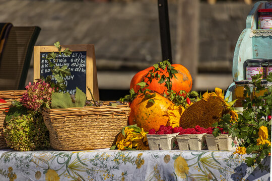 Autumn farm stand with pumpkins and fresh produce