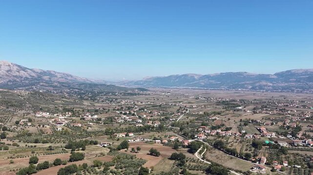 Aerial view of the Vallo di Diano valley with farmland, olive groves and scattered villages surrounded by the Apennine mountains, Salerno, Campania, southern Italy