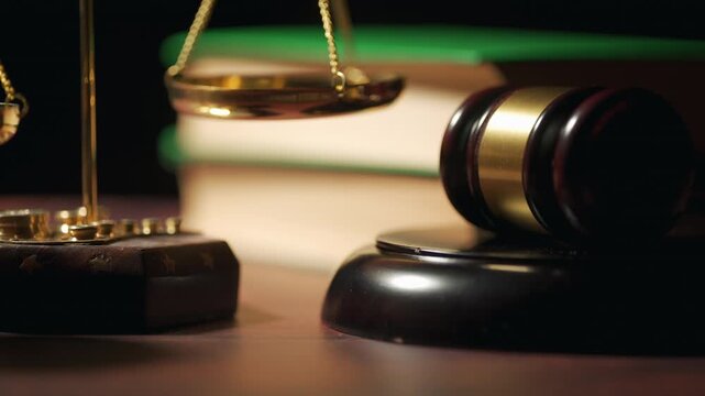 Judge gavel beside the scales of justice and law books. Court, legal advice and attorney office