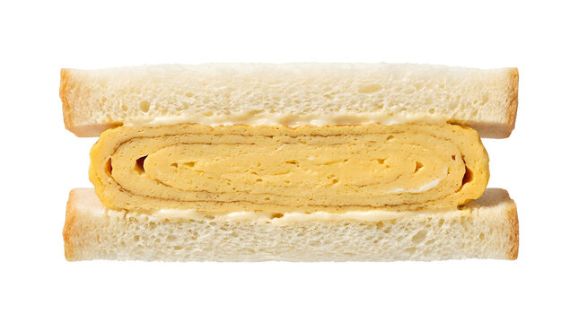 Close up Japanese tamago sando sandwich filled with thick soft rolled omelet between white bread slices isolated on transparent background. 