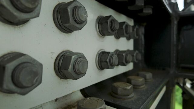 Close up of heavy duty bolts and nuts on steel beam connection