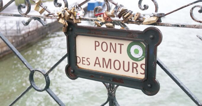 Love locks on Pont des Amours bridge in Annecy France,Love locks attached to the Pont des Amours, or Lovers&rsquo; Bridge, a romantic landmark in Annecy, France, with the canal water below.