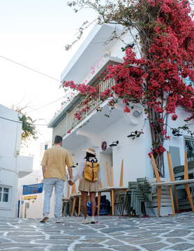 Charming blue tables on a sunlit street in Naousa, Paros, Greece