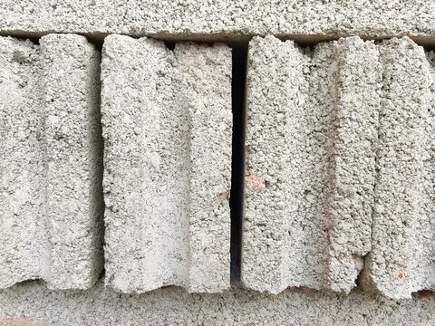 Close-up View of Rough Grey Concrete Blocks Wall Texture Pattern