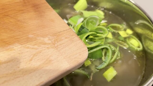 Adding Sliced Leek Into a Simmering Chicken Soup