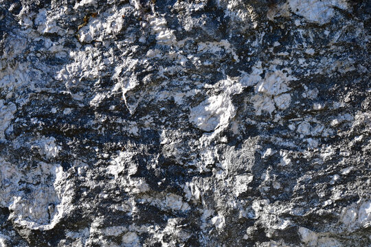 rough granite stone of a grave
