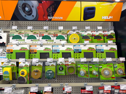 Aubrey, Texas, USA - September 22nd, 2026: Gator sanding accessories and disc packages arranged on rack inside AutoZone retail store