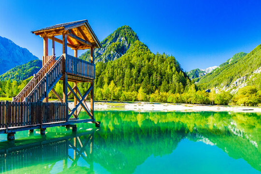 Observation deck on Jasna lake in Kranjska Gora, Slovenia. Julian Alps in background.
