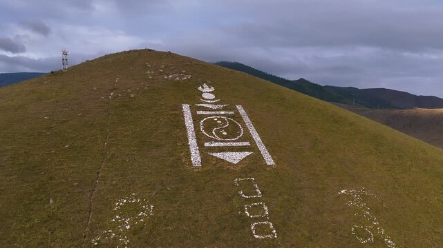 Drone Shot of Soyombo Emblem on Hillside Over Ulaanbaatar in Morning Sun