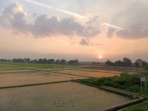 morning sky captured from inside a train in west java, indonesia