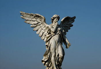 Fototapeta premium Spirituality and religion concept marble angel statue with wings spread on a clear blue sky peace hope and divine protection